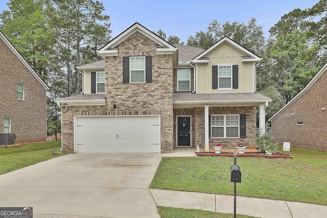 craftsman inspired home featuring cooling unit, a garage, and a front lawn