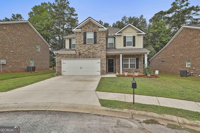 craftsman house with a garage, central AC, and a front lawn