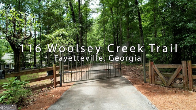 view of gate with fence