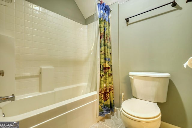 bathroom with lofted ceiling, shower / tub combo, and toilet