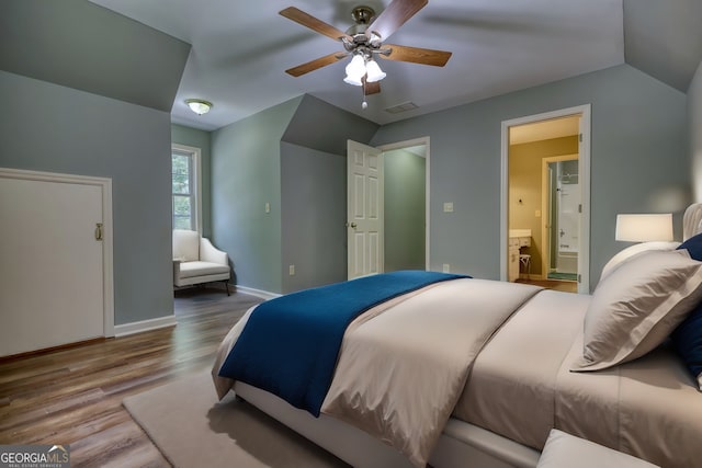 bedroom featuring wood-type flooring, ensuite bathroom, and ceiling fan