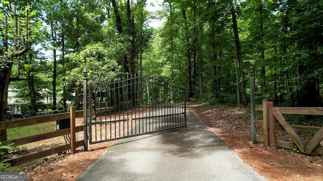 view of gate featuring fence