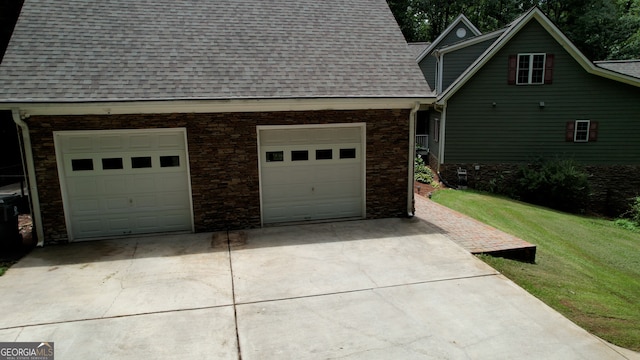 garage with a lawn