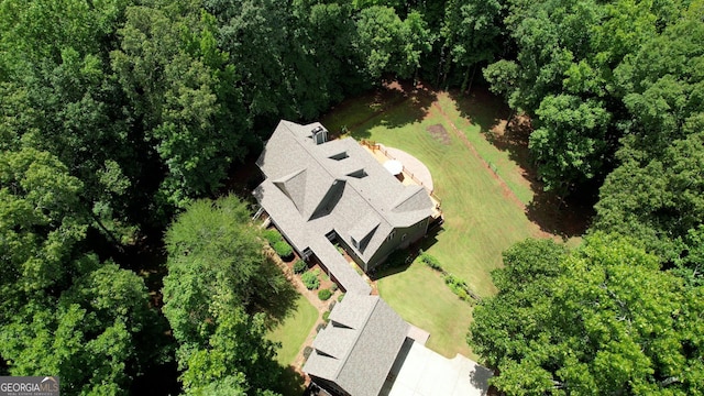 drone / aerial view with a view of trees