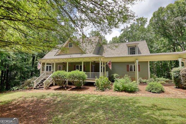 view of front of property with a front yard and covered porch