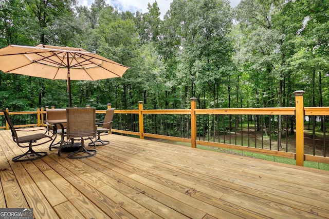 wooden deck with outdoor dining area