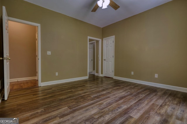 unfurnished bedroom with ceiling fan and hardwood / wood-style floors