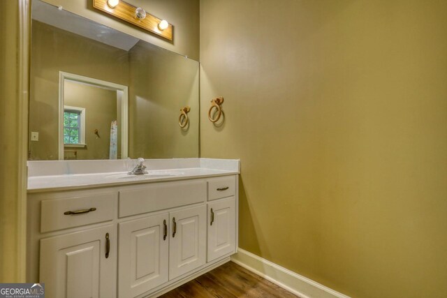 bathroom with vanity and wood-type flooring