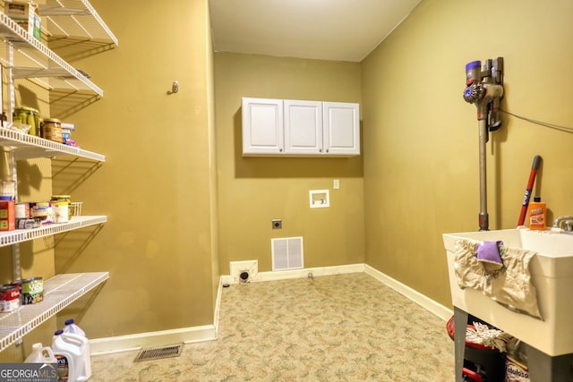 laundry room with light carpet, cabinets, hookup for a washing machine, and hookup for an electric dryer