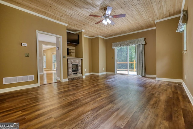 unfurnished living room featuring a stone fireplace, wood finished floors, wood ceiling, visible vents, and baseboards