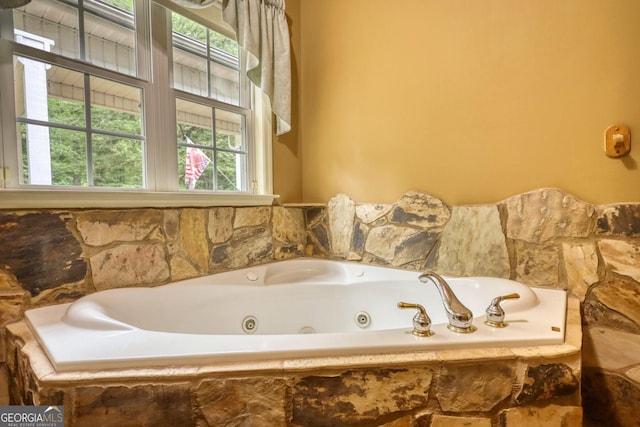 full bathroom featuring a jetted tub