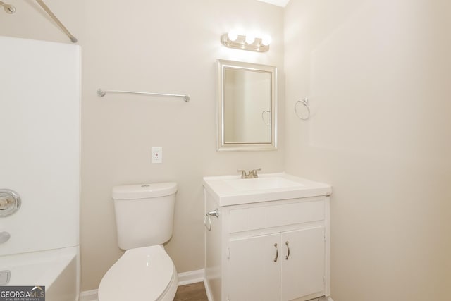 bathroom featuring vanity and toilet