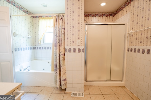 bathroom featuring independent shower and bath and tile patterned floors