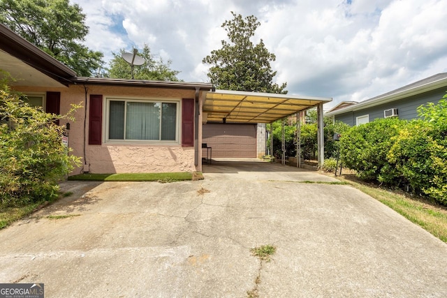 view of front of home featuring a carport and a garage