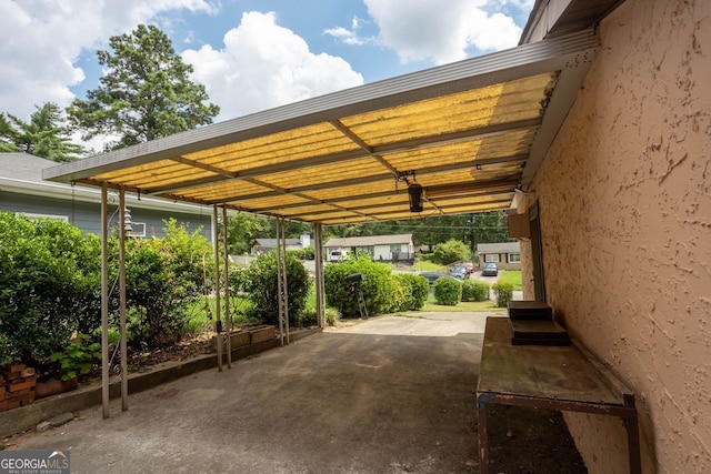 view of vehicle parking featuring a carport