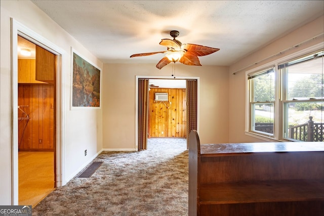 unfurnished bedroom with ceiling fan and carpet flooring