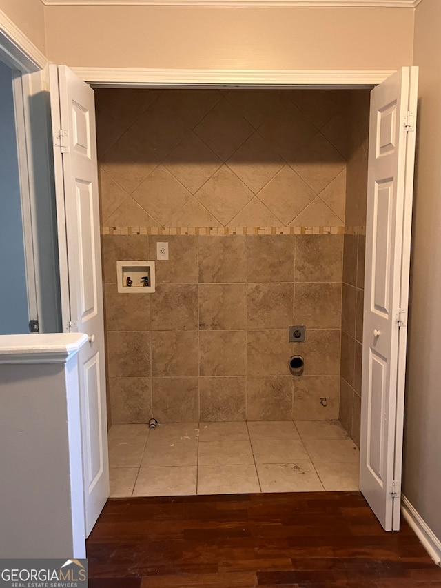 bathroom with hardwood / wood-style flooring