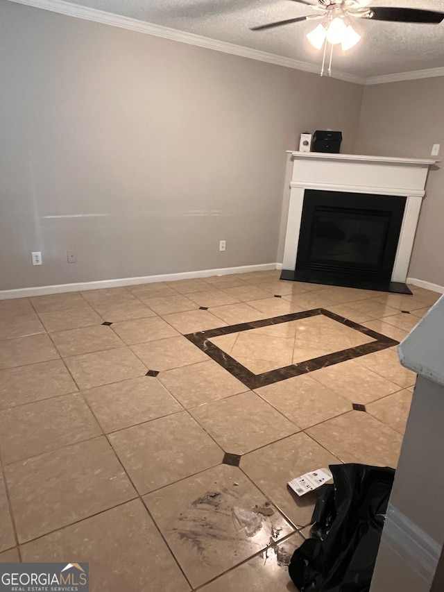 unfurnished living room with ornamental molding, a textured ceiling, light tile patterned floors, and ceiling fan