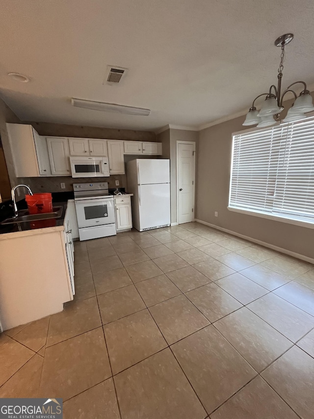 kitchen with white appliances, sink, light tile patterned flooring, white cabinetry, and ornamental molding