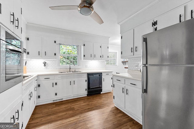 kitchen featuring sink, a wealth of natural light, white cabinets, and appliances with stainless steel finishes