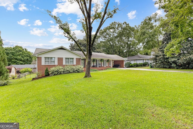 ranch-style home with a front lawn