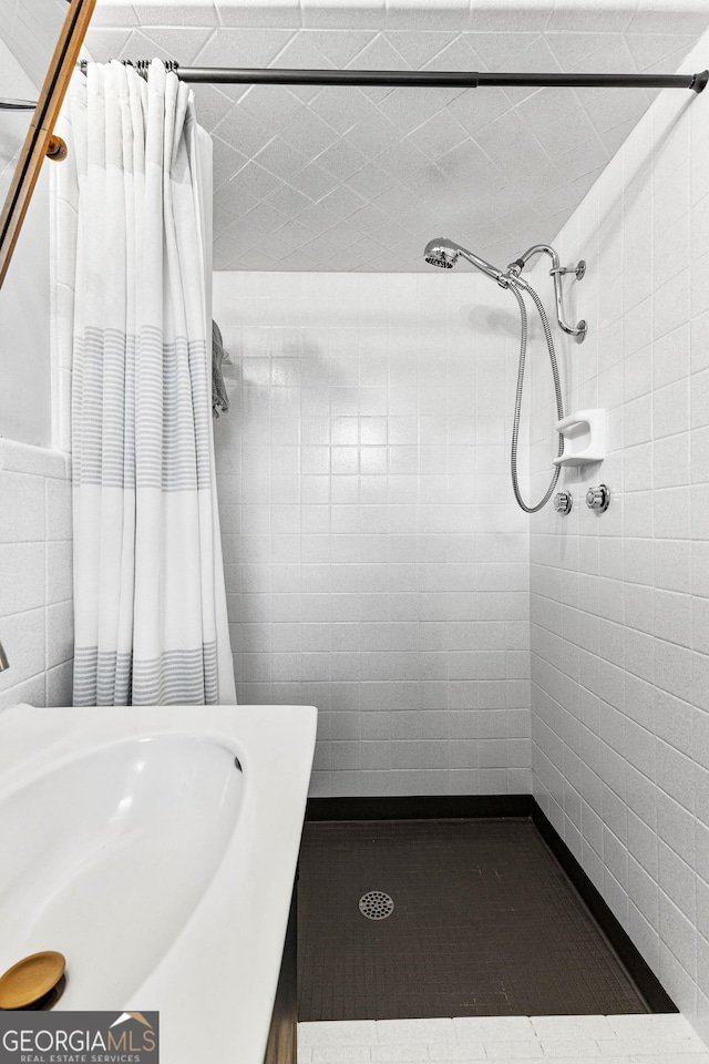 bathroom featuring walk in shower