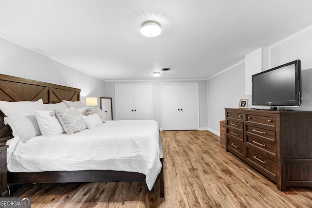 bedroom with ornamental molding and light wood-type flooring