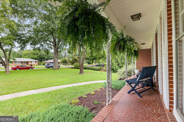 view of yard with covered porch