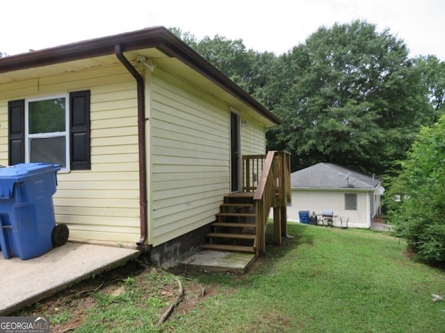 view of property exterior featuring a lawn