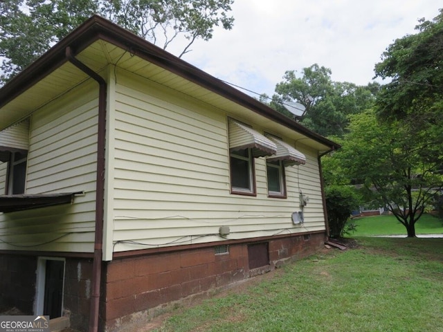 view of property exterior featuring a yard