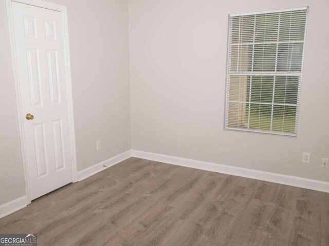 empty room featuring hardwood / wood-style flooring