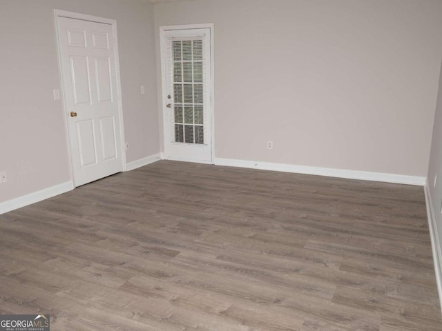 spare room featuring hardwood / wood-style floors