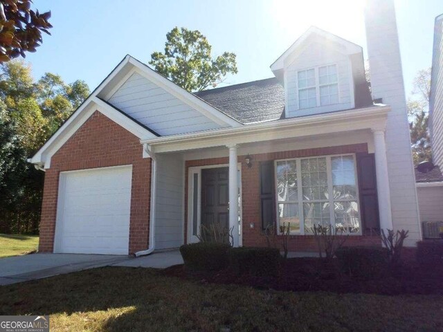 view of front of house featuring a garage and covered porch