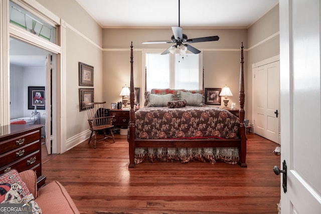 bedroom with ceiling fan, dark hardwood / wood-style flooring, and a closet