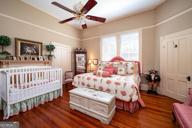 bedroom with hardwood / wood-style flooring and ceiling fan