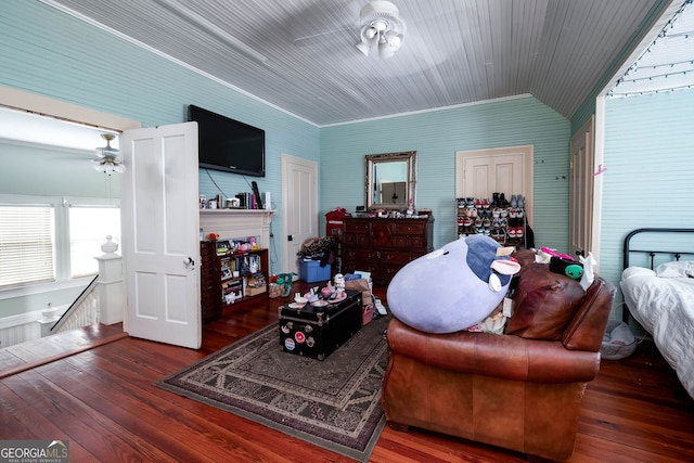 living room with crown molding, ceiling fan, and hardwood / wood-style flooring