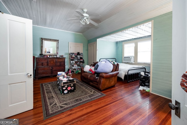 interior space featuring hardwood / wood-style flooring, vaulted ceiling, ceiling fan, and cooling unit