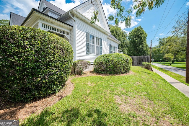 view of home's exterior featuring a lawn