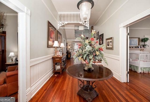 interior space featuring dark wood-type flooring and ornamental molding