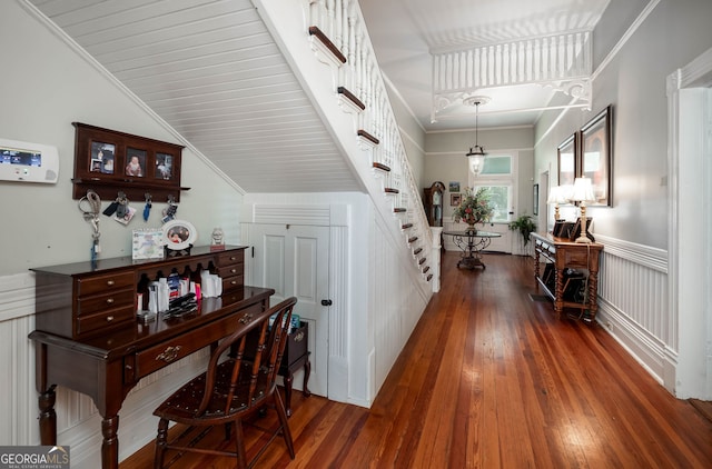 hall featuring crown molding and dark hardwood / wood-style flooring