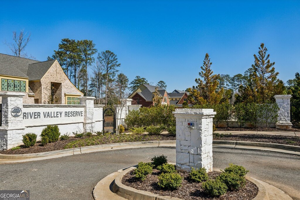 rear view of property featuring a lawn