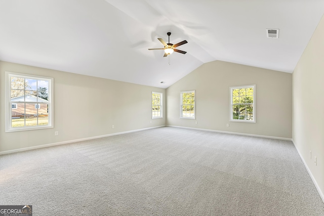 spare room with light carpet, ceiling fan, and lofted ceiling