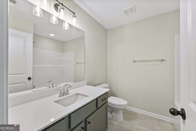 bathroom with a shower, tile patterned floors, vanity, and toilet