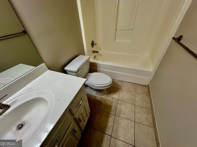 full bathroom with tile patterned flooring, vanity, shower / bathing tub combination, and toilet