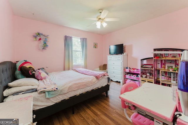 bedroom with wood-type flooring and ceiling fan