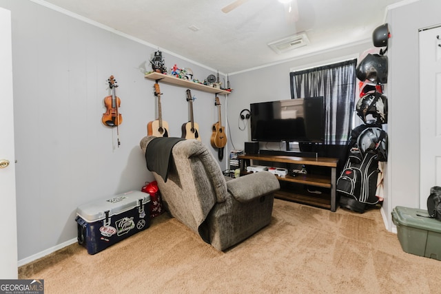 living room with light carpet, crown molding, and ceiling fan