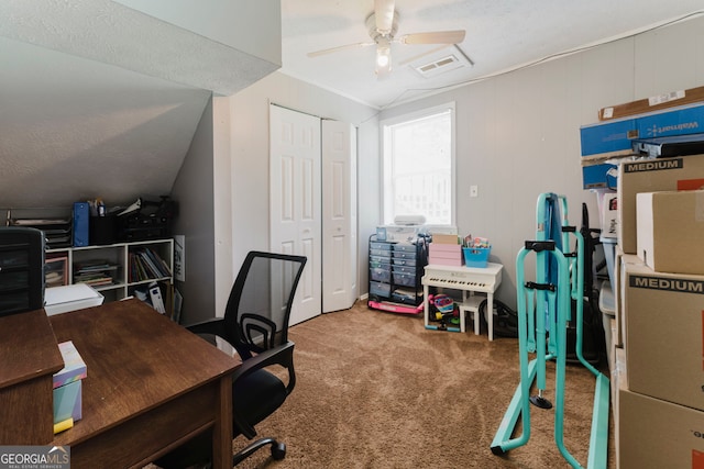 carpeted office with lofted ceiling, a textured ceiling, and ceiling fan