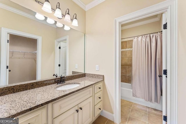 bathroom with tile patterned flooring, ornamental molding, shower / bath combination with curtain, and vanity