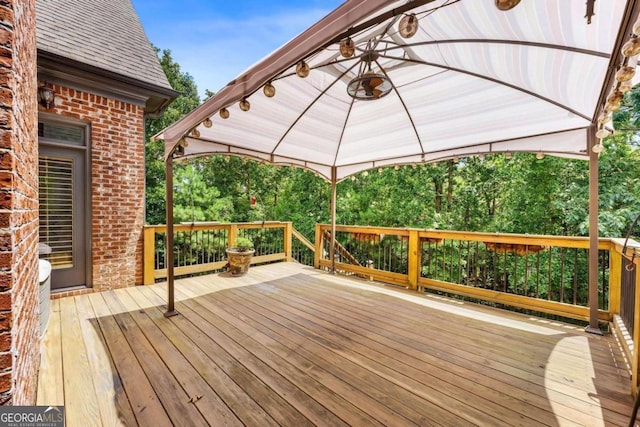 wooden deck featuring a gazebo