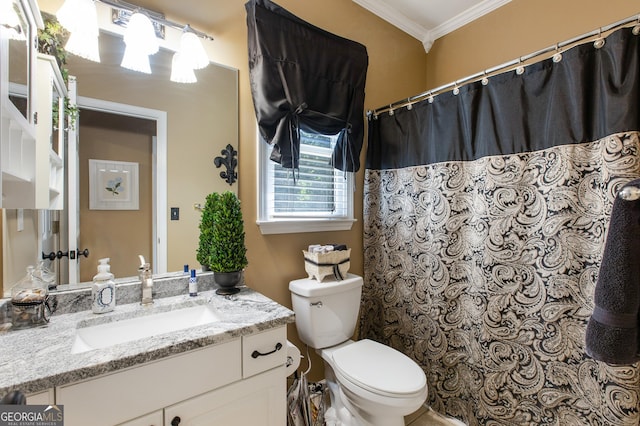 bathroom featuring ornamental molding, toilet, and vanity